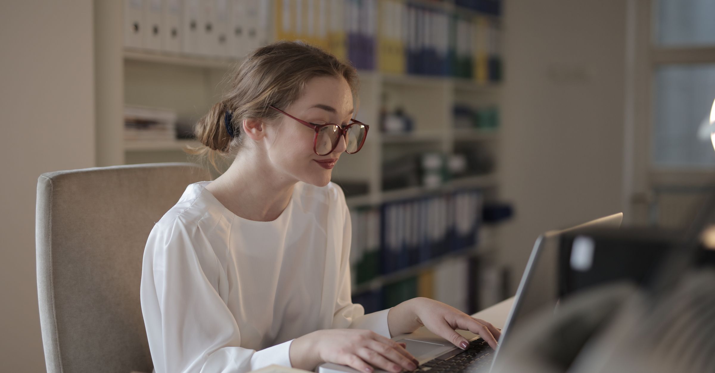 Sales employee working through account history and contact information in CRM software