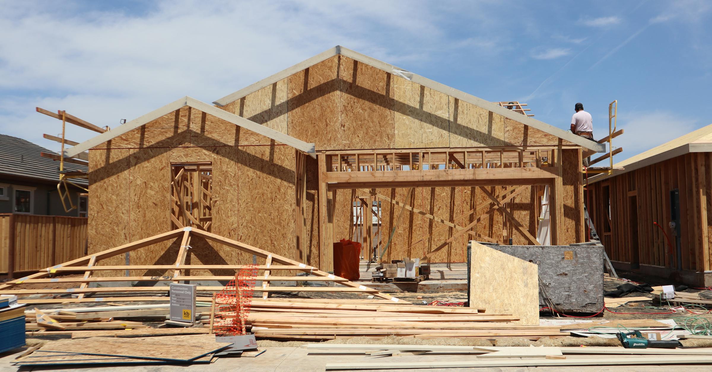 New home construction site in Elk Grove — framed residential building under construction